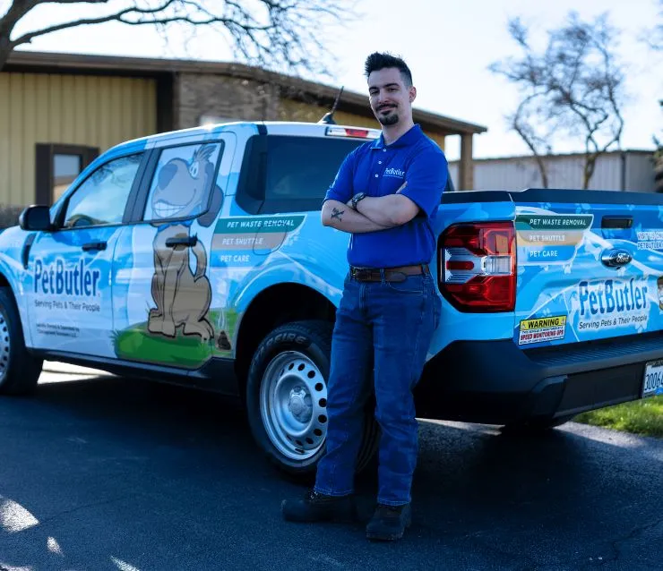 Andrew Alexander, owner of Pet Butler of Fredericksburg, VA, standing next to a Pet Butler truck.