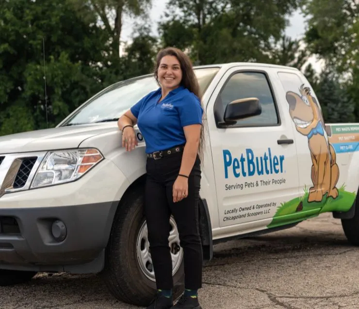 Courtney Elliott, owner of Pet Butler of Smyrna, GA, standing next to a Pet Butler truck.