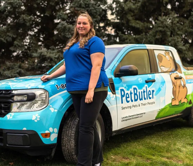 Jennifer Folsom, owner of Pet Butler of Londonderry, NH, standing next to a Pet Butler truck.