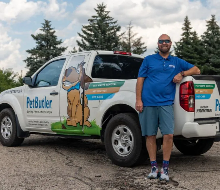 Eric Hoffpauir, owner of Pet Butler of San Antonio, TX, standing next to a Pet Butler truck.