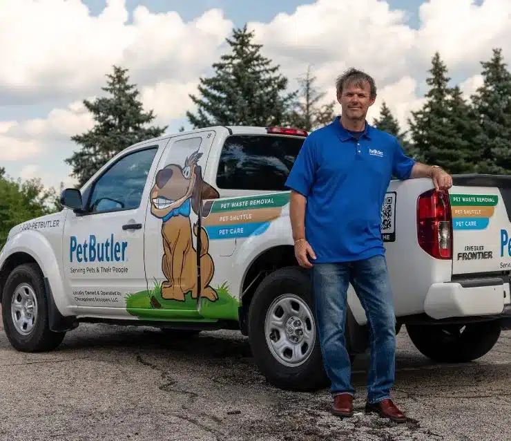 Ryan Leland, owner of Pet Butler of Bellevue, WA, standing next to a Pet Butler truck.