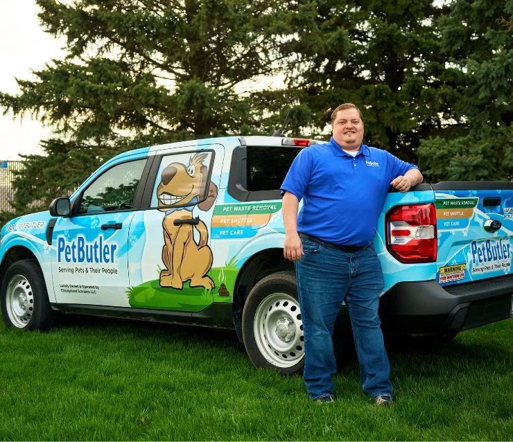 Rob Moore, owner of Pet Butler of Clarksville, TN, standing next to a Pet Butler truck.
