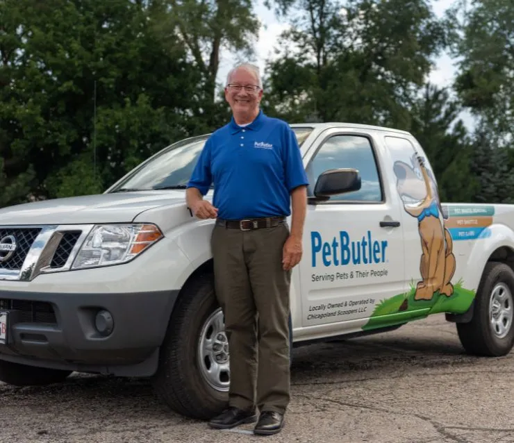 Richard Raymond, owner of Pet Butler of Mission Viejo, CA, standing next to a Pet Butler truck.