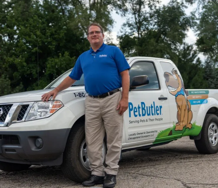 John Andrade, owner of Pet Butler of Warwick, RI, standing next to a Pet Butler truck.