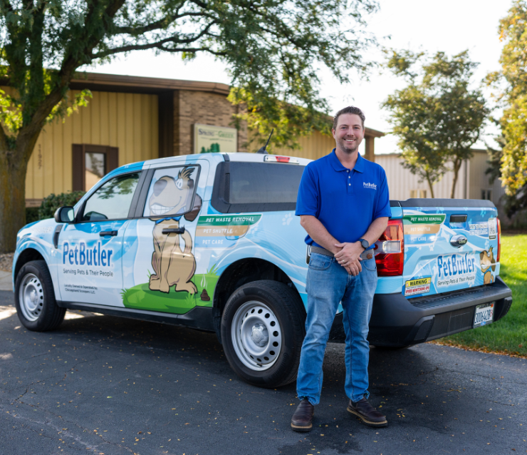 Pet Butler Franchise owner in front of Pet Butler truck