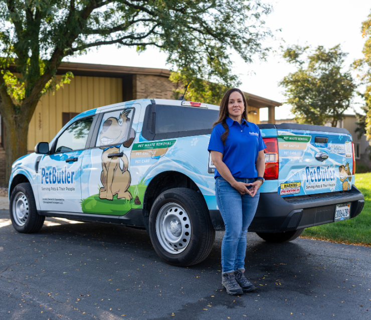 Franchise owner in front of Pet Butler truck