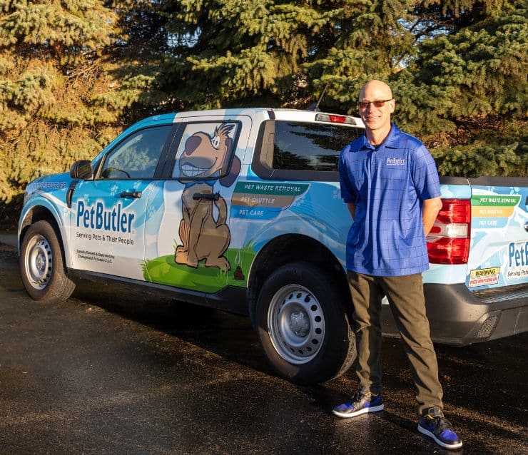 Pet Butler Franchise owner in front of Pet Butler truck