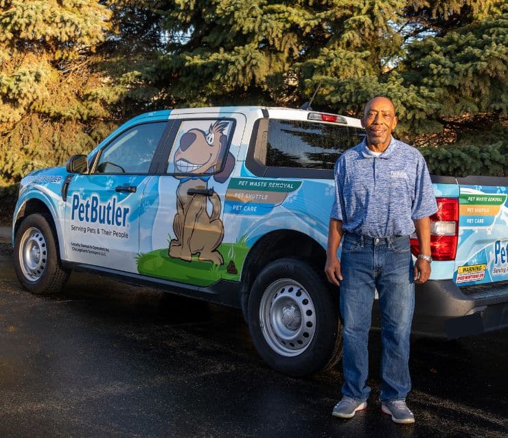 Pet Butler Franchise owner in front of Pet Butler truck